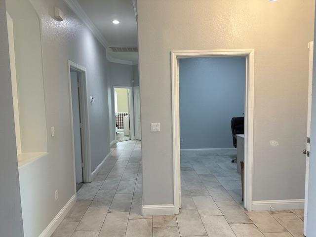 5357 E Burns, Fresno, CA 93725 - hall with ornamental molding and light tile patterned floors