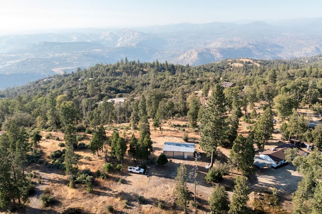 bird's eye view with a wooded view and a mountain view