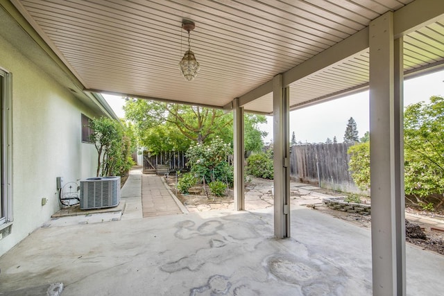view of patio / terrace with fence private yard and central air condition unit