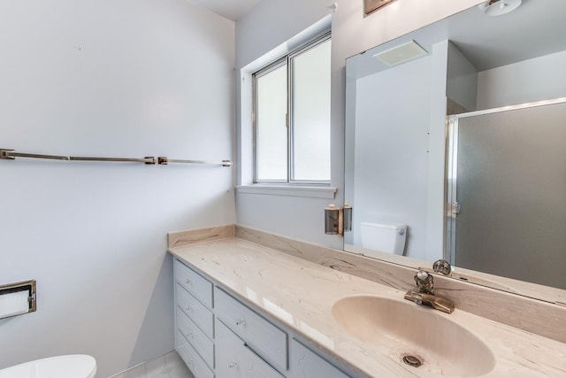 full bathroom with toilet, vanity, visible vents, and a stall shower