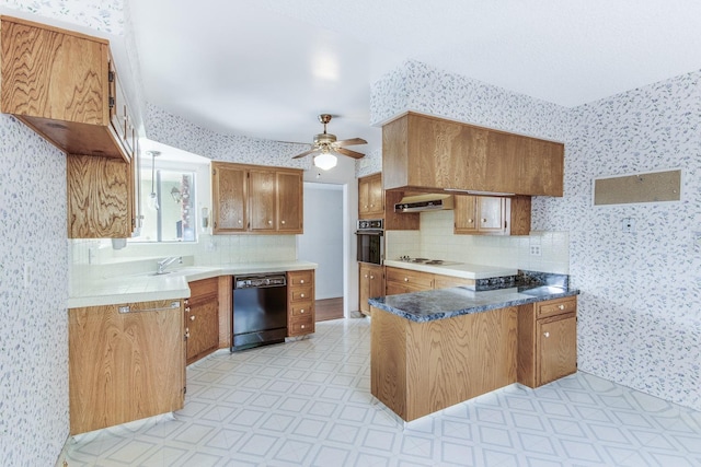 kitchen with light floors, wallpapered walls, a peninsula, and black appliances