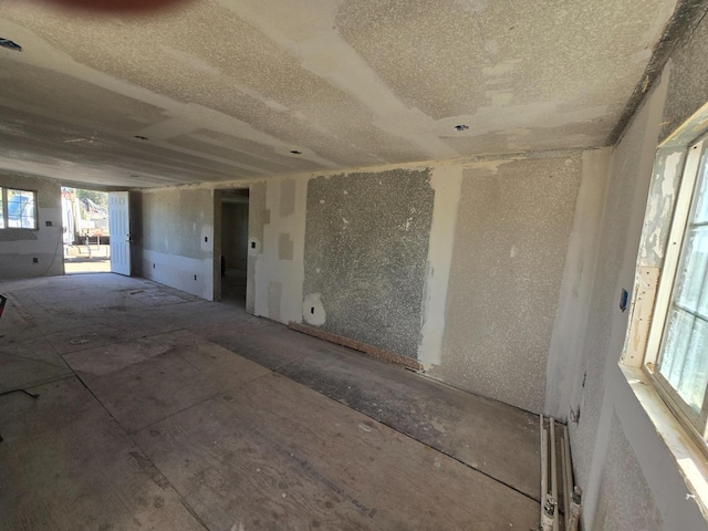 12441 S Henderson Rd, Caruthers, CA 93609 - empty room featuring a textured ceiling and plenty of natural light