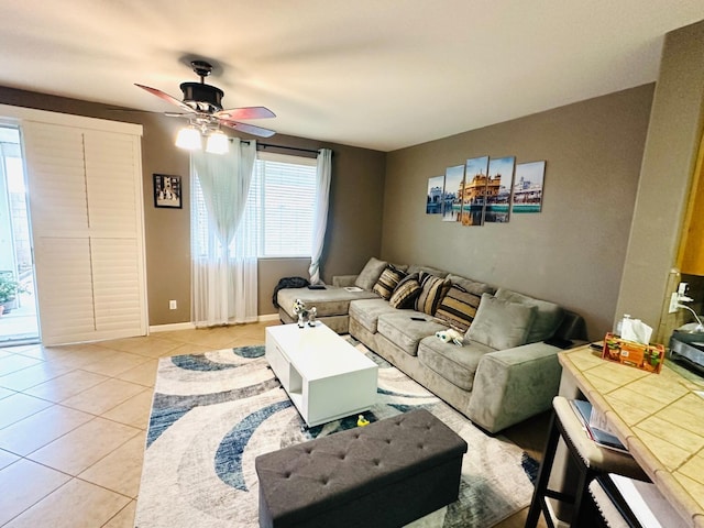 2148 S Villa Ave, Fresno, CA 93727 - living area featuring a ceiling fan, baseboards, and light tile patterned floors