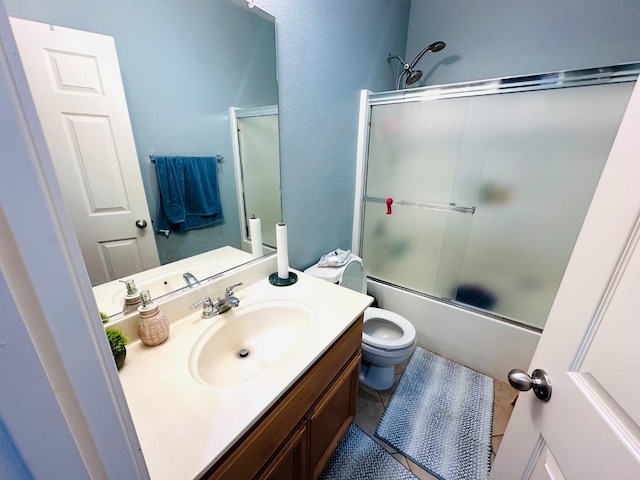 2148 S Villa Ave, Fresno, CA 93727 - bathroom with enclosed tub / shower combo, toilet, vanity, and tile patterned floors