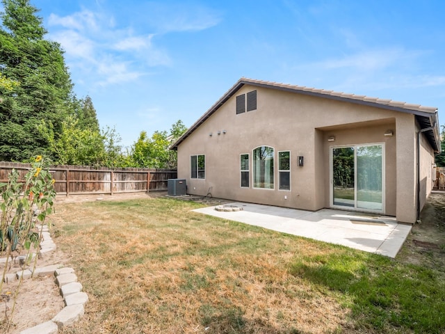 1026 E Carnoustie Ave, Fresno, CA 93730 - back of house with fence, cooling unit, stucco siding, a patio area, and a lawn