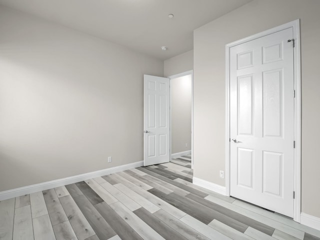 1026 E Carnoustie Ave, Fresno, CA 93730 - unfurnished bedroom featuring baseboards and light wood finished floors