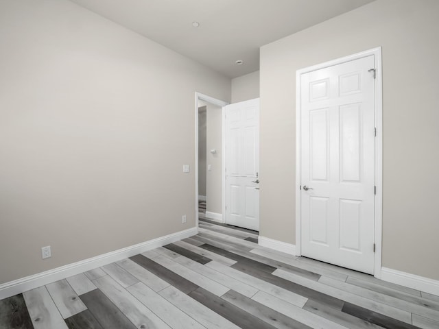 1026 E Carnoustie Ave, Fresno, CA 93730 - unfurnished bedroom with baseboards and light wood-type flooring