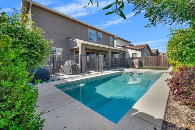 2653 Vermont Ave, Clovis, CA 93619 - view of swimming pool featuring fence, area for grilling, and a patio area