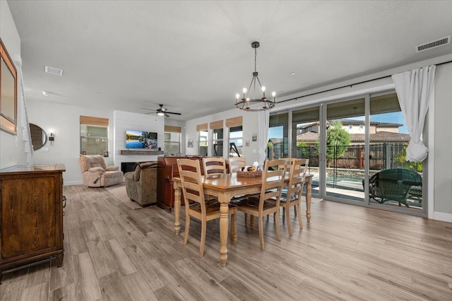 2653 Vermont Ave, Clovis, CA 93619 - dining room with a chandelier, ceiling fan, light wood-style flooring, and baseboards