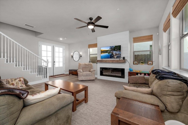 2653 Vermont Ave, Clovis, CA 93619 - living area with stairs, ceiling fan, a glass covered fireplace, baseboards, and recessed lighting