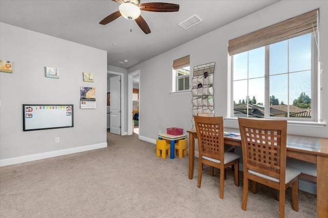 2653 Vermont Ave, Clovis, CA 93619 - dining area with ceiling fan, light colored carpet, and baseboards