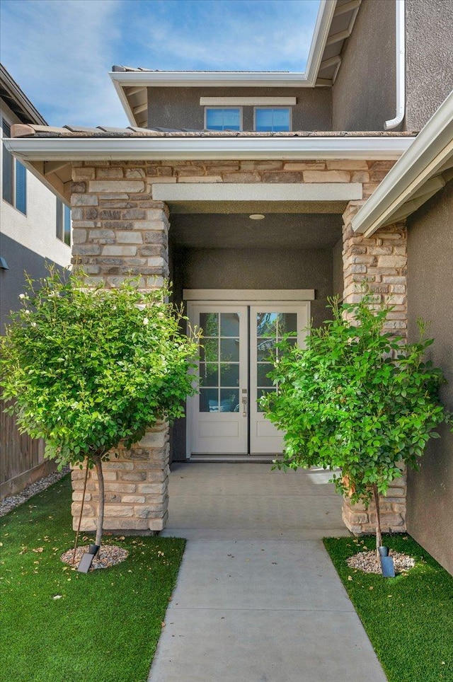 2653 Vermont Ave, Clovis, CA 93619 - view of exterior entry with stone siding, french doors, and stucco siding