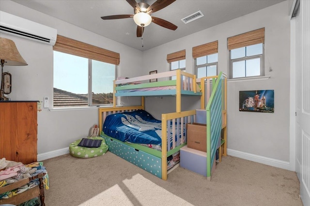 2653 Vermont Ave, Clovis, CA 93619 - carpeted bedroom featuring a wall unit AC, baseboards, and ceiling fan