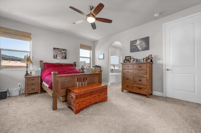 2653 Vermont Ave, Clovis, CA 93619 - bedroom with light colored carpet, arched walkways, and a ceiling fan