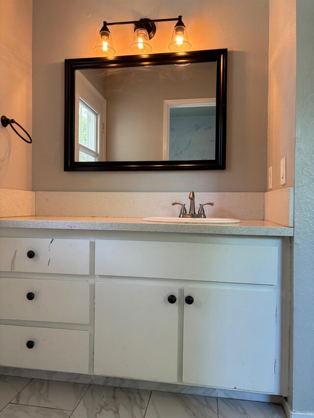 271 W Paul, Fresno, CA 93704 - bathroom featuring vanity and marble look tile flooring
