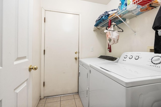 3617 Clay Ct, Selma, CA 93662 - laundry area with washer and dryer, light tile patterned flooring, and laundry area