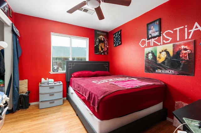 3617 Clay Ct, Selma, CA 93662 - bedroom with a ceiling fan, wood finished floors, and visible vents
