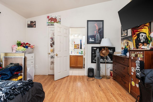 3617 Clay Ct, Selma, CA 93662 - bedroom featuring light wood finished floors, vaulted ceiling, and connected bathroom