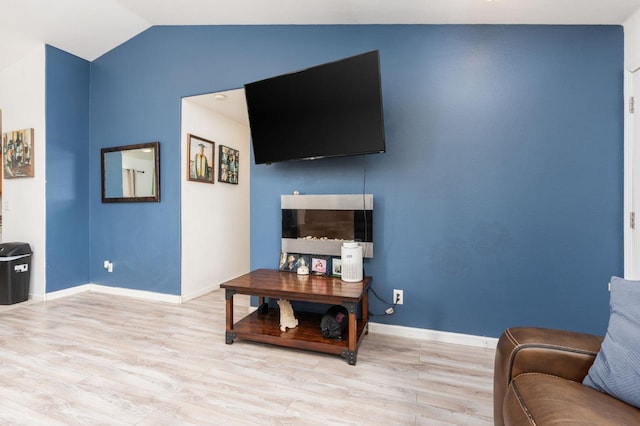 3617 Clay Ct, Selma, CA 93662 - living room featuring light wood-style floors, vaulted ceiling, and baseboards