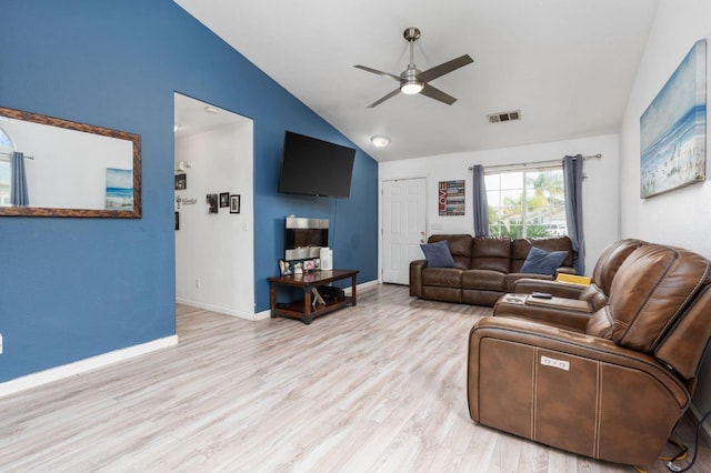 3617 Clay Ct, Selma, CA 93662 - living room featuring lofted ceiling, wood finished floors, visible vents, baseboards, and ceiling fan