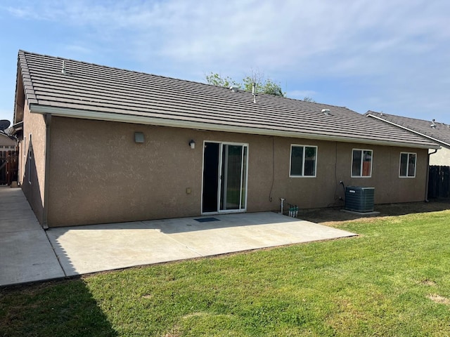 1836 Heidi Ave, Sanger, CA 93657 - rear view of house featuring a tile roof, a yard, central air condition unit, and stucco siding
