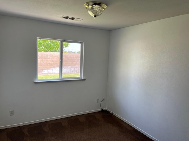 1836 Heidi Ave, Sanger, CA 93657 - empty room featuring dark carpet, visible vents, and baseboards
