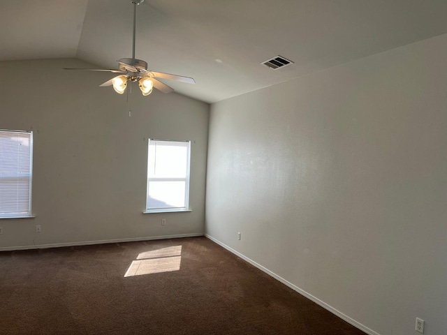 1836 Heidi Ave, Sanger, CA 93657 - spare room with vaulted ceiling, baseboards, visible vents, dark carpet, and ceiling fan