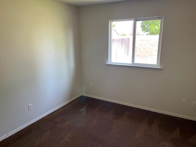 1836 Heidi Ave, Sanger, CA 93657 - spare room with dark colored carpet and baseboards