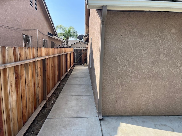 1836 Heidi Ave, Sanger, CA 93657 - view of side of home featuring stucco siding and fence