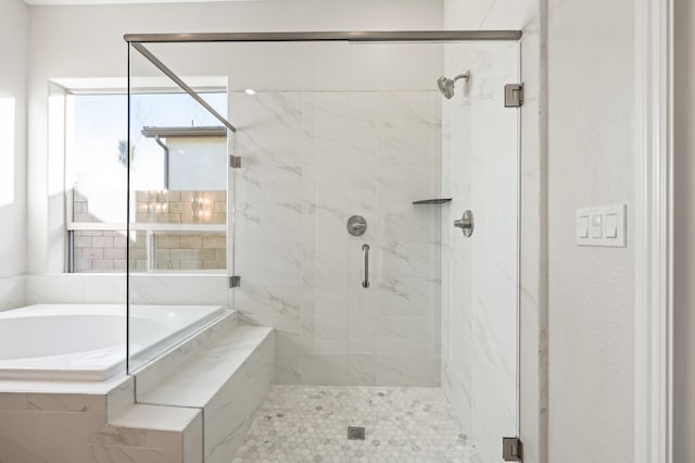 11182 N Via Ravenna Dr, Fresno, CA 93730 - bathroom featuring a shower stall and a garden tub