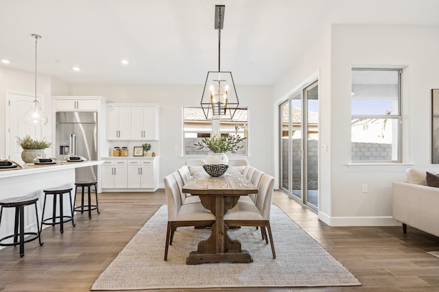11182 N Via Ravenna Dr, Fresno, CA 93730 - dining area with light wood-style flooring, baseboards, recessed lighting, and a notable chandelier