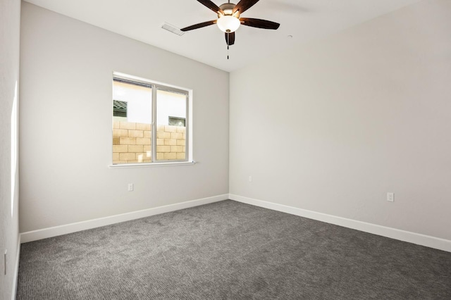 11182 N Via Ravenna Dr, Fresno, CA 93730 - unfurnished room featuring visible vents, baseboards, dark carpet, and ceiling fan