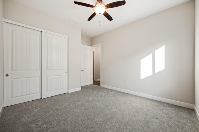 11182 N Via Ravenna Dr, Fresno, CA 93730 - unfurnished bedroom featuring carpet, visible vents, a closet, baseboards, and ceiling fan