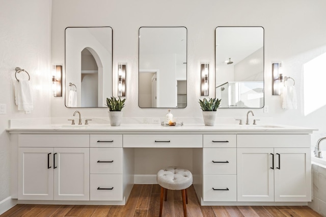 11182 N Via Ravenna Dr, Fresno, CA 93730 - full bath with wood finished floors, a sink, and double vanity
