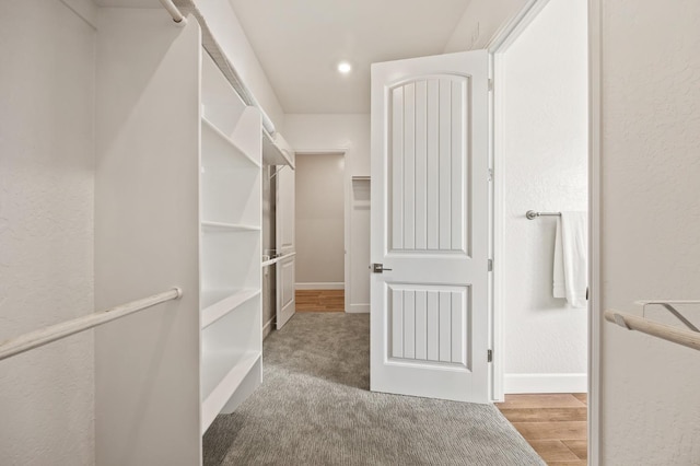11182 N Via Ravenna Dr, Fresno, CA 93730 - spacious closet featuring wood finished floors