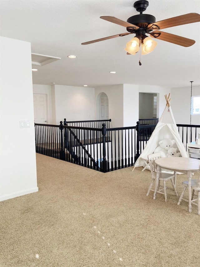 interior space featuring a ceiling fan, baseboards, carpet, and recessed lighting