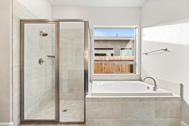 6294 E Miillie Dr, Fresno, CA 93727 - bathroom featuring a shower stall and a garden tub
