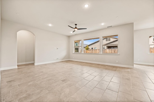 6294 E Miillie Dr, Fresno, CA 93727 - empty room with ceiling fan, arched walkways, visible vents, and recessed lighting