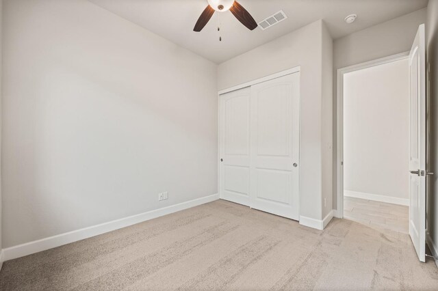 6294 E Miillie Dr, Fresno, CA 93727 - unfurnished bedroom with carpet flooring, baseboards, visible vents, a closet, and ceiling fan