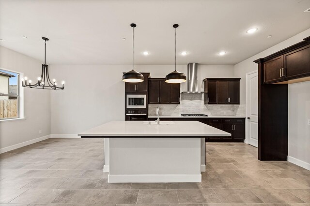 6294 E Miillie Dr, Fresno, CA 93727 - kitchen featuring wall chimney range hood, a sink, stainless steel microwave, wall oven, and tasteful backsplash