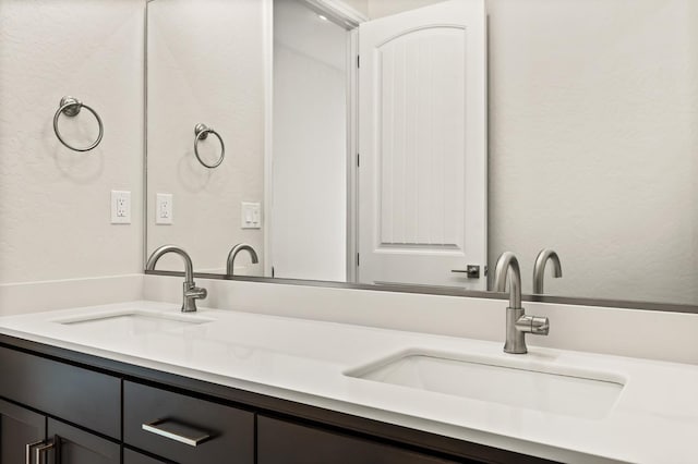 6294 E Miillie Dr, Fresno, CA 93727 - full bath with a textured wall, a sink, and double vanity