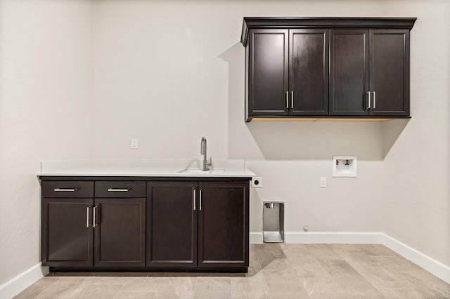 6294 E Miillie Dr, Fresno, CA 93727 - clothes washing area with a sink, hookup for an electric dryer, baseboards, washer hookup, and cabinet space