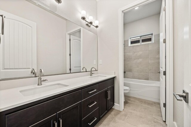 6294 E Miillie Dr, Fresno, CA 93727 - full bathroom featuring toilet, tile patterned floors, a sink, and double vanity