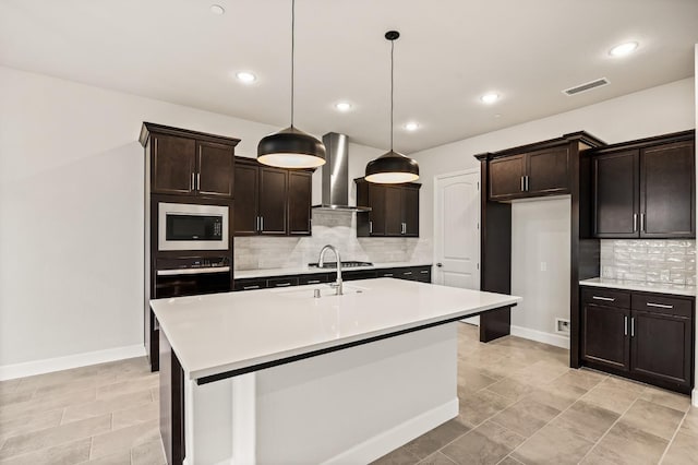 6294 E Miillie Dr, Fresno, CA 93727 - kitchen featuring wall chimney range hood, a sink, decorative backsplash, stainless steel appliances, and light countertops