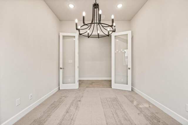 6294 E Miillie Dr, Fresno, CA 93727 - unfurnished dining area featuring an inviting chandelier, french doors, carpet floors, and baseboards