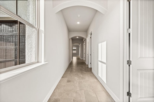 6294 E Miillie Dr, Fresno, CA 93727 - corridor featuring recessed lighting, arched walkways, and baseboards