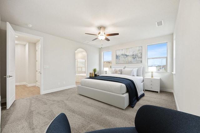 4288 N Phoenix, Fresno, CA 93723 - carpeted bedroom with arched walkways, a ceiling fan, and ensuite bathroom