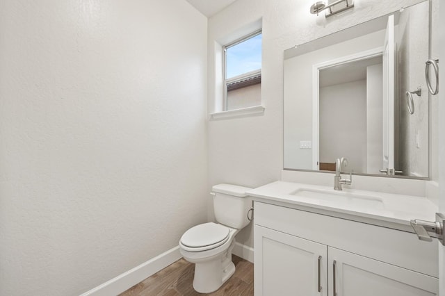 4288 N Phoenix, Fresno, CA 93723 - half bath featuring vanity and wood finished floors