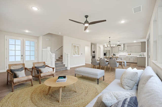4288 N Phoenix, Fresno, CA 93723 - living area with stairs, a chandelier, ceiling fan, light wood-type flooring, and recessed lighting