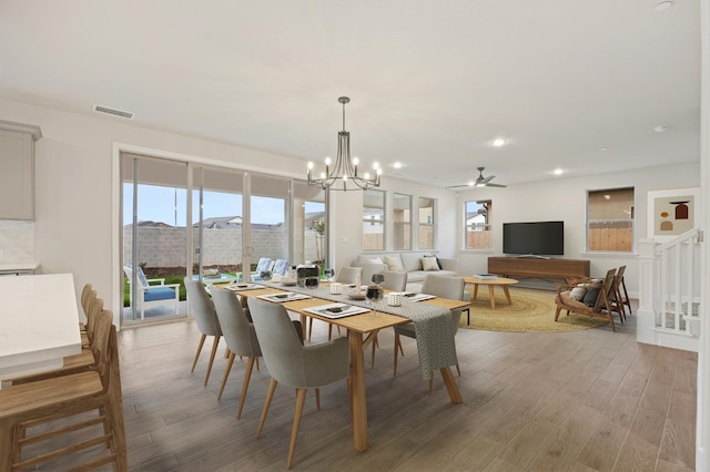4288 N Phoenix, Fresno, CA 93723 - dining space with wood finished floors, a chandelier, recessed lighting, and a ceiling fan